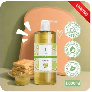 Limited edition Theo10 body wash on a green background with a slice of toast and a jar of green spread, a LIMITED ribbon, three round badges and a 1,000ml tag